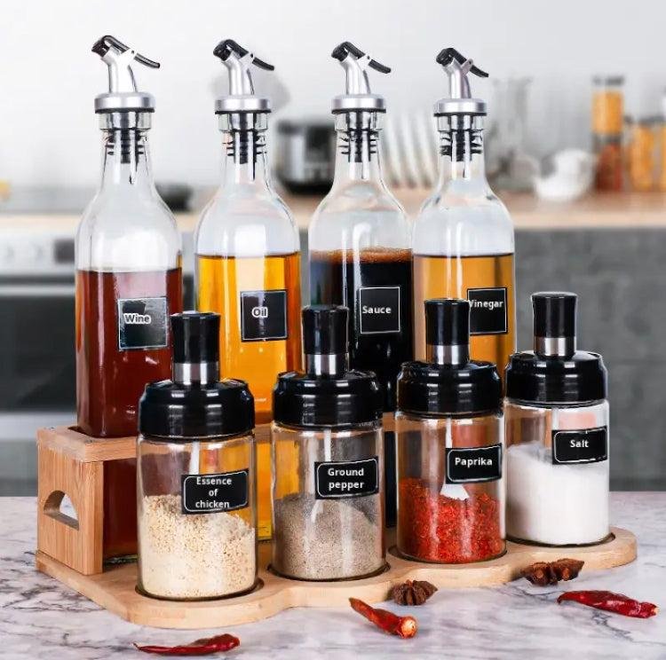 Kitchen condiment and spice organizer set on a wooden tray